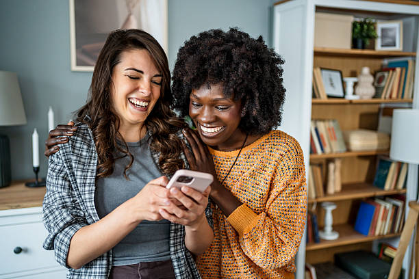 istock Laughing friends enjoying time together at home 2223247131