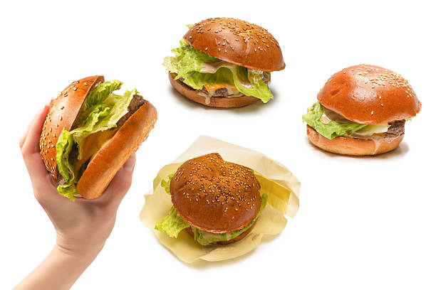 istock Hamburger in woman hands isolated on a white background. 2223248244