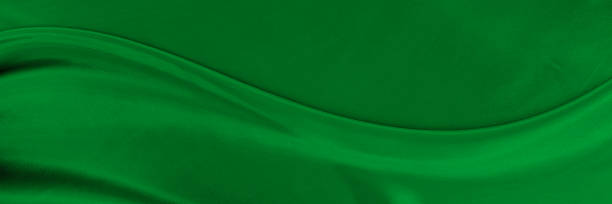 istock Black green satin dark fabric texture luxurious shiny that is abstract silk cloth background with patterns soft waves blur beautiful. 2223250428