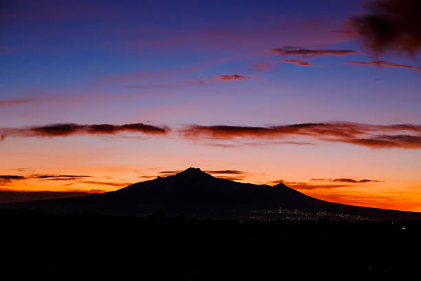 istock Mount teide silhouette at sunrise with colorful cloudscape 2223256983