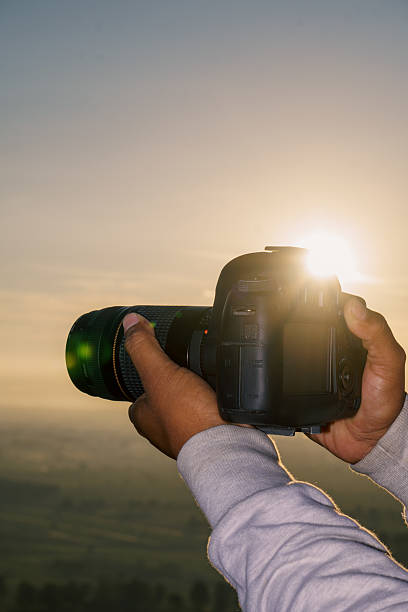 istock Photographer holding camera in the mountains 2223259380