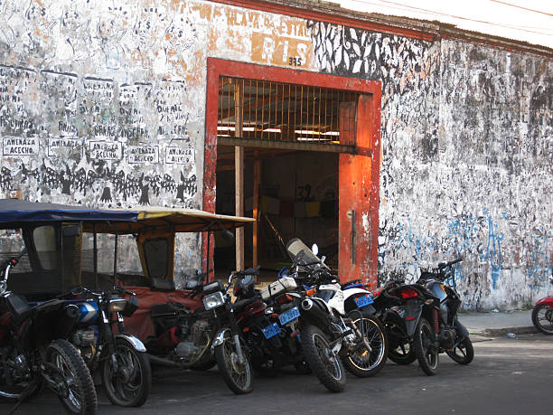Iquitos, Peru September 07, 2016: Motorcycle shop with taxis