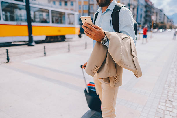 istock Businessman with suitcase on business trip 2223263645