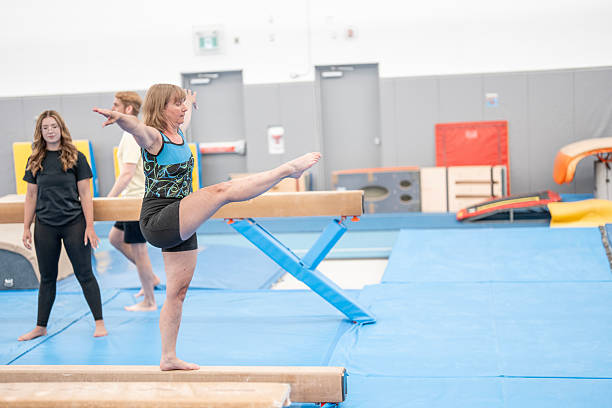 little girls practice artistic gymnastics