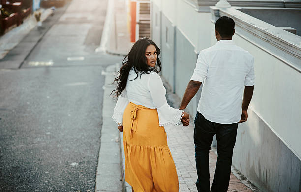 istock omantic Couple Strolling in Urban Sunset 2223267641