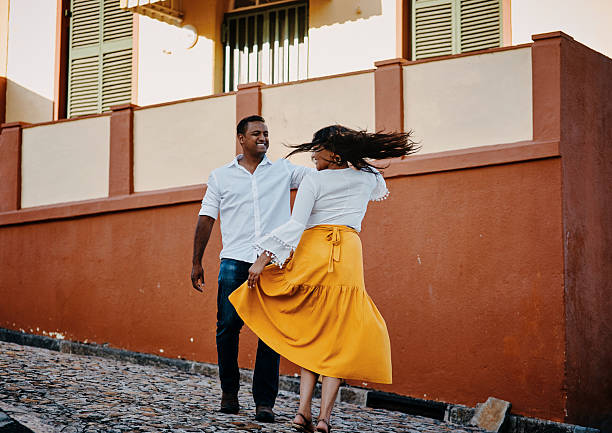 istock Joyful Couple Dancing on a Cobblestone Street 2223267848