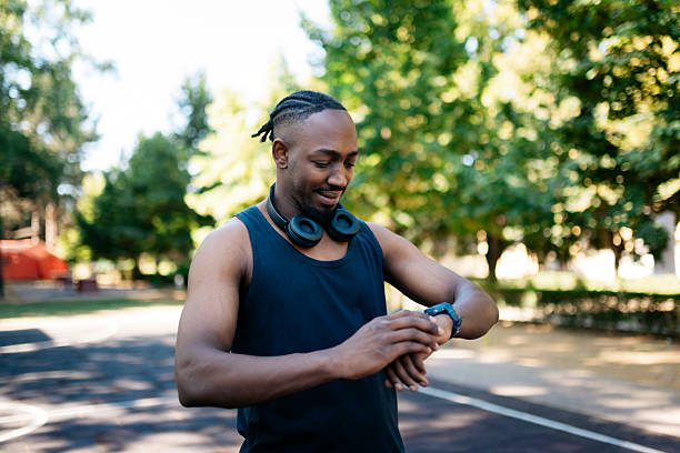 istock Young sportsman checking performance on smartwatch after training 2223268314