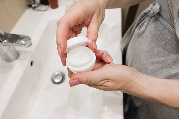 istock Woman Following Morning Bathroom Routine in Bathrobe 2223268575