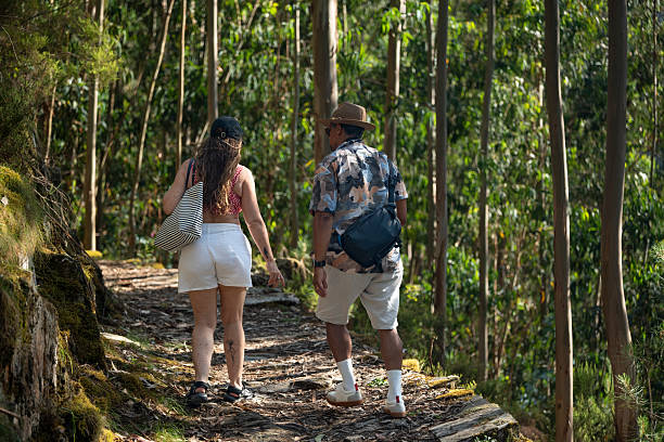 Tourists in the forest in summer in the village of Piódão, Coimbra, Portugal