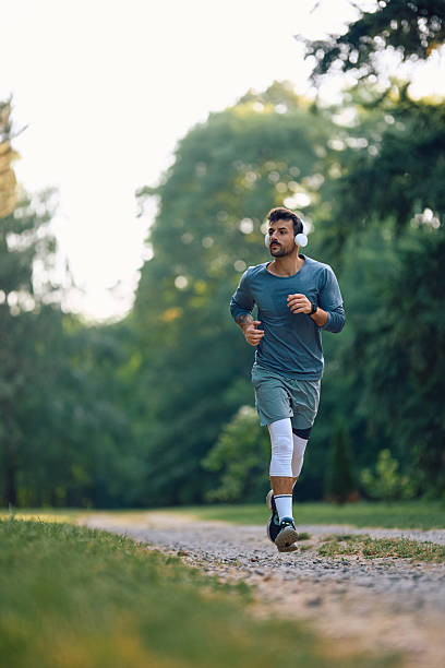 istock Athletic man running during his sports training in nature. 2223271879