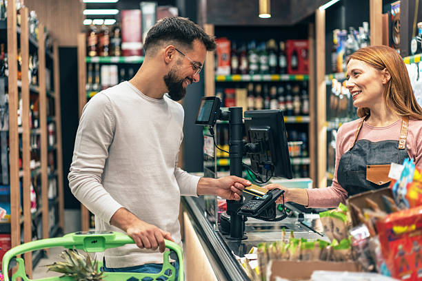 istock Man paying for shopping in supermarket 2223272869