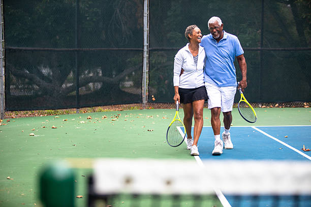 istock Senior Black Couple on Tennis Court 2223274607