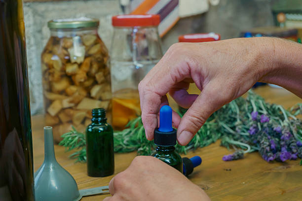 istock Herbalist preparing tincture bottles with dropper caps 2223274644