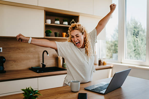 istock Excited freelancer celebrating success working from home 2223275681