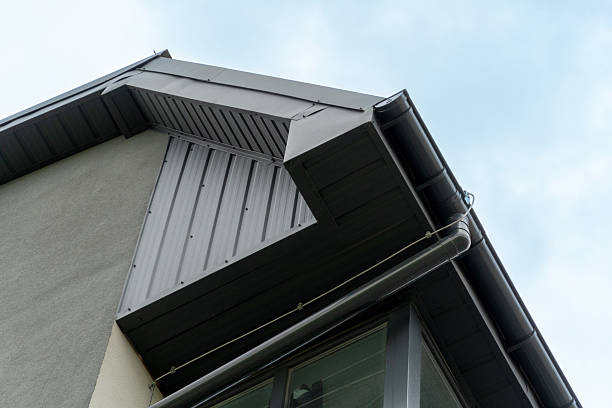 istock View of a contemporary building highlighting a sharp roofline, metallic siding, and large windows, showcasing modern architecture against a clear sky 2223285765