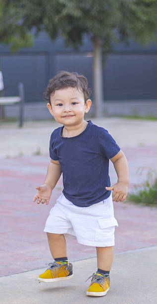 istock Joyful toddler playing outdoors in a vibrant park on a sunny day 2223287212