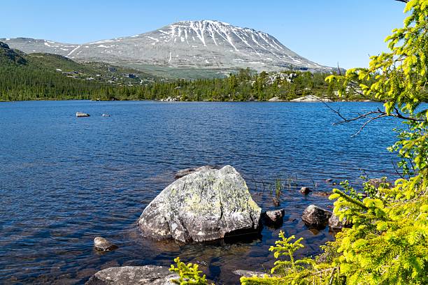 istock Clear Mountain Lake with Gaustatoppen View 2223288592