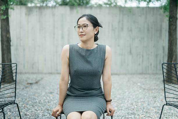 The Asian businesswoman closed her eyes to rest