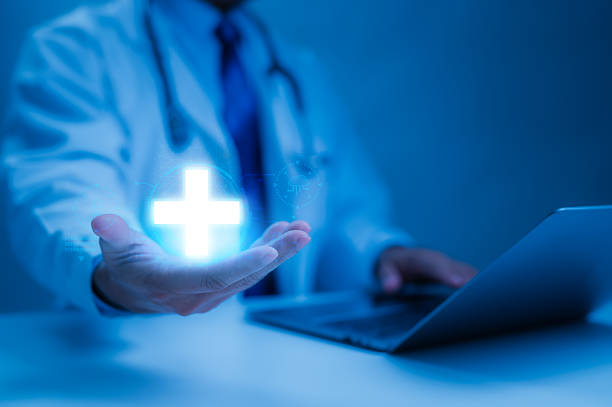 istock Futuristic Blue Medicine Doctors Hand Emanating Digital Cross, Merging Technology Data Driven Medicine With Laptop Network, Healthcare In Digital Age 2223290296