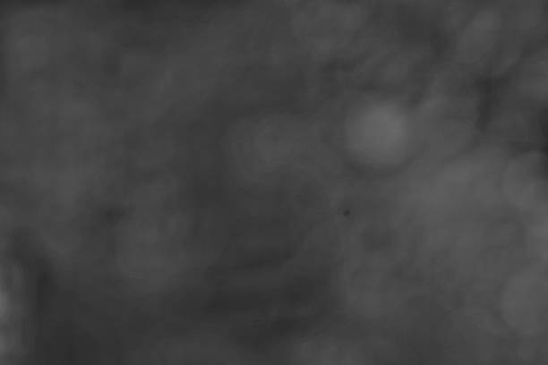 Elegant gray abstract background featuring a blurred bokeh effect, perfect for adding a touch of sophistication to your designs. Use as a texture, overlay, or stylish backdrop.