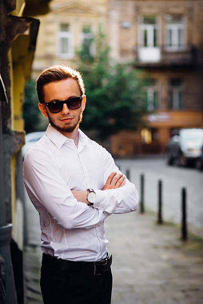 istock Summer day. Front view. Young bearded man dressed in white shirt 2223292664