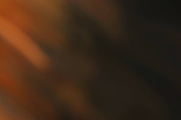 istock Abstract blend of dark brown and orange tones creating a warm texture 2223293671