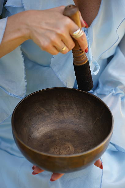 istock Hand Holding Tibetan Singing Bowl Outdoors 2223295943