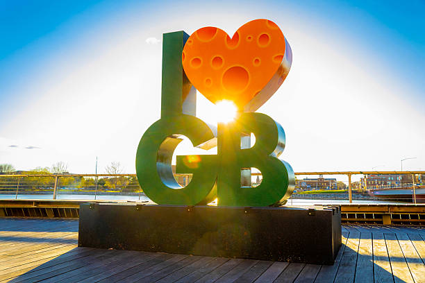 Green Bay, WI, USA - 04-29-2025: I Love Green Bay sculpture at CityDeck features a green and gold heart made of cheese