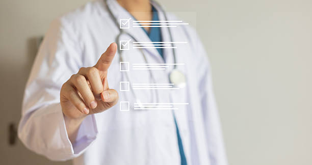 istock close up young general practitioner hand use stylus pen to check box on medical checklist or opd record to read and diagnose and assess about patient's symptom for healthy and lifestyle concept 2223300509