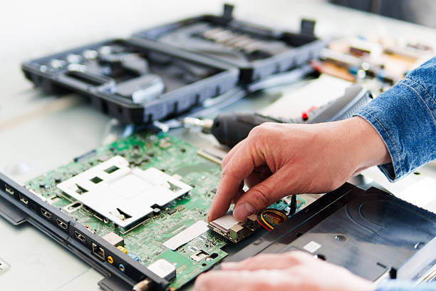 istock Technician repairing motherboard of modern tv in workshop 2223304231