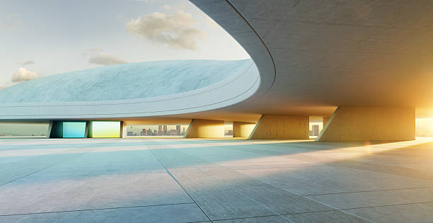 istock 3D rendering futuristic concrete building exterior with empty parking lot at sunset 2223307287