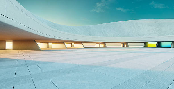 istock 3d rendering modern architecture concrete building showing empty parking lot at sunset 2223307318