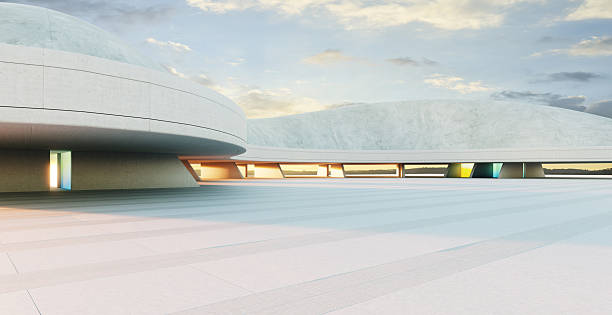 istock 3D rendering futuristic concrete building with colorful windows at sunset 2223307452