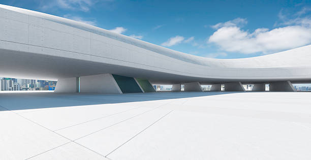 istock 3d rendering empty concrete ground under futuristic building with city skyline in background 2223307491