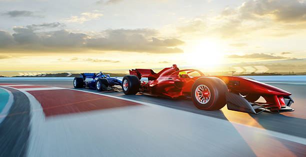 Red auto racing car overtaking a blue competitor on a racing track at sunset. 3D rendering