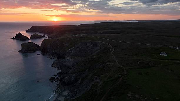 istock Scenic coastal sunset with cliffs and vibrant sky. 2223312280