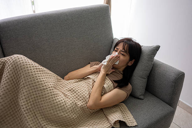 istock Sick Woman Resting on Sofa at Home 2223313133