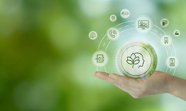 istock Digital Wellbeing and Detox Concep. Holding a glowing digital interface with icons representing mental wellness on green background. Balance between staying connected and practicing digital detox. 2223316483