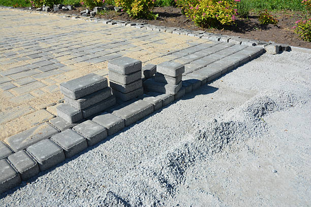 istock Patio pavement construction near the house. Laying paver bricks. 2223318693