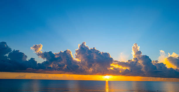 istock Sky on sunset. Beauty sunrise with sunlight background. Twilight, dramatic dawn, dusk, sunshine. Cloudy sunset. Sunset wallpaper. Sky sunset overlay. Peaceful horizon. Panorama of glow shiny sky. 2223319252