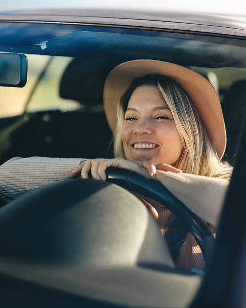 istock Happy woman enjoying while relaxing in a car. 2223322482