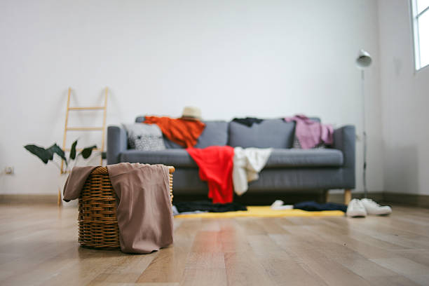 istock Messy Clothes At Living Room 2223324243