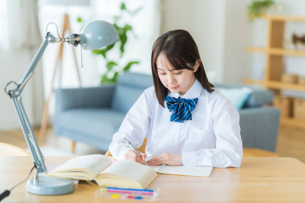 High school girl studying at home