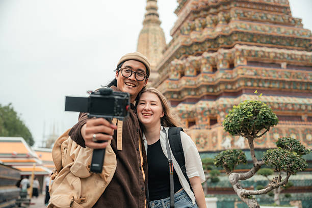 istock Influencer Couple Filming a Vlog While Exploring a Famous Temple Together 2223326524