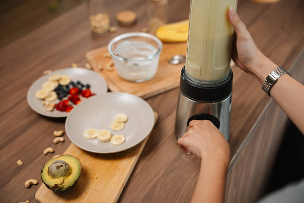 istock Health-Conscious Woman Preparing a Nutritious Meal Before Heading to Work on cozy kitchen 2223331483