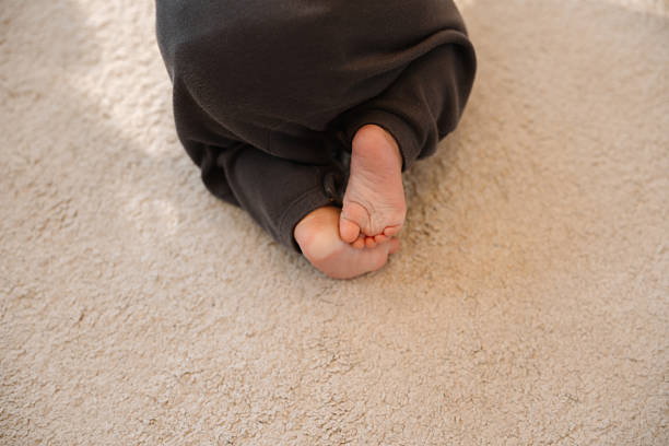 istock Curious Baby Learning to Walk and Crawl in a Safe and Cozy Environment 2223331514