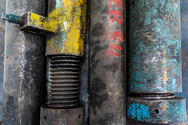 A detailed close-up of rusted and weathered metal components, showcasing textures and colors from years of use and exposure.