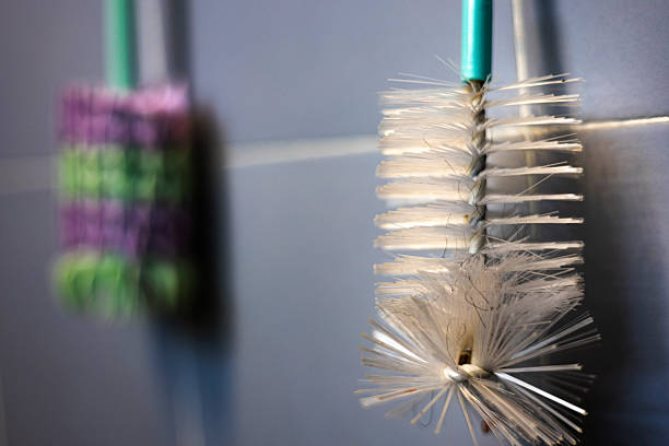 Bottle Brush Is Hung On The Wall In The Bathroom, Background for advertising and wallpaper in tool and cleaning scene
