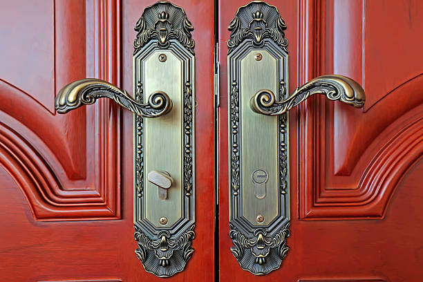 Dark red wood door and handle, closeup of photo
