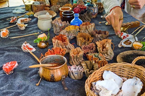 Handmade Natural Dyes and Pigments in Traditional Setting. Medieval Craft Workshop with Natural Pigments and Tools. Selective focus.